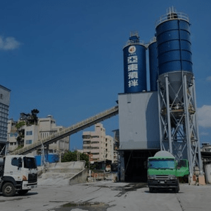 Industrial cement silo with load monitoring equipment installed for precision inventory management.